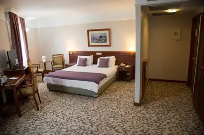 a hotel room with a bed and a desk at Dila Hotel in Istanbul