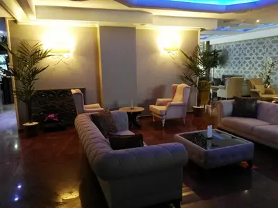 a lobby with couches and chairs and a table at Hermanos Hotel in Istanbul