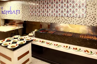 a kitchen with many plates of food on a counter at Darkhill Hotel in Istanbul