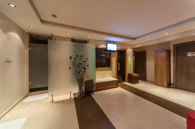 a lobby with a vase of flowers on the wall at Senabil Hotel Old City & Spa in Istanbul