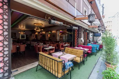 a restaurant with tables and chairs on a patio at Senabil Hotel Old City & Spa in Istanbul