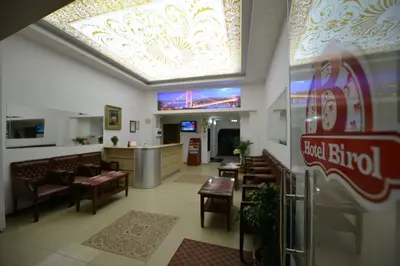 a restaurant with chairs and a dining room with a ceiling at Birol Hotel in Istanbul