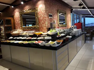 a buffet line with many plates of food at Grand Unal Hotel in Istanbul