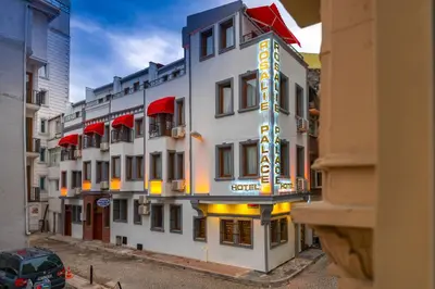 a large white building with a sign on it at Rosalie Palace Hotel in Istanbul