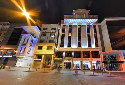 a group of buildings on a city street at night at Samir Deluxe Hotel in Istanbul