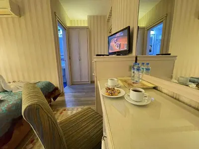 a hotel room with a table with two cups of coffee at Hotel Novano in Istanbul