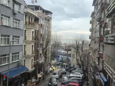 a city street with parked cars and buildings at Asitane Life Hotel in Istanbul