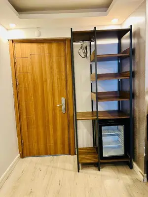 a room with a wooden door and a book shelf at Sirkeci Quietness Hotel in Istanbul