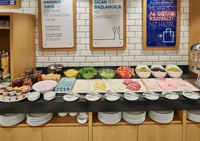 a display of food on a counter in a restaurant at Holiday Inn Express - Istanbul - Atakoy Metro by IHG in Istanbul