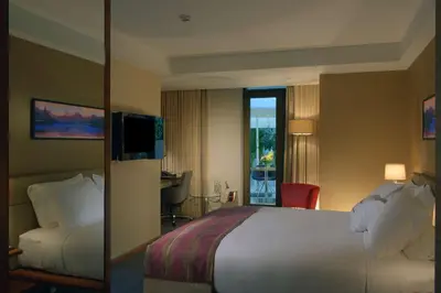 a hotel room with a bed and a balcony at DoubleTree By Hilton Istanbul - Old Town in Istanbul