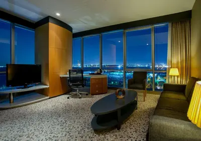a living room with a couch and a large window at DoubleTree By Hilton Istanbul - Moda in Istanbul