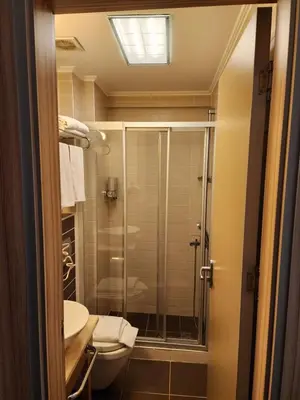 a bathroom with a shower and a toilet at Nanda Hotel in Istanbul