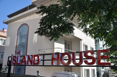 a sign that reads the stand house in front of a building at dragos island hotel in Istanbul