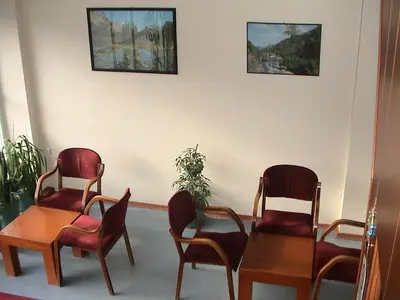 a waiting room with three chairs and a table at Cagri Hotel in Istanbul
