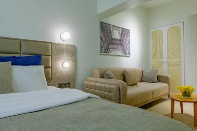 a bedroom with a bed and a couch at The Wilson Galata Hotel in Istanbul