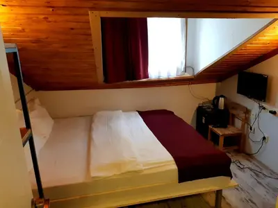 a bedroom with a bed and a window in a room at Hot Budget Ortakoy in Istanbul