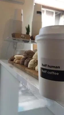a shelf with a cup of coffee and some donuts at Hot Budget Ortakoy in Istanbul