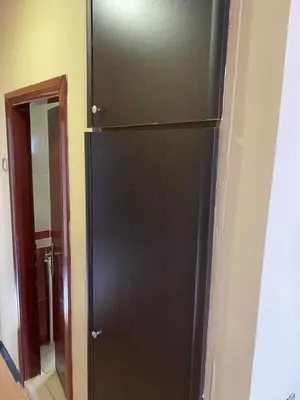 a black refrigerator in a room with a mirror at Odrys Beach Hotel & Resort in Tekirdag