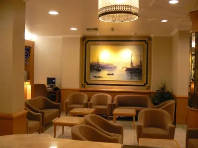 a waiting room with chairs and a painting on the wall at Hotel Inter Istanbul in Istanbul