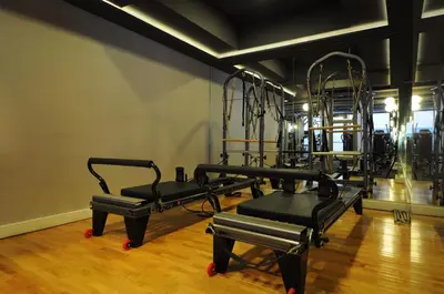 a gym with several tread machines in a room at Innpera Hotel in Istanbul