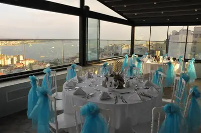 a dining room with a table and chairs with a view at Innpera Hotel in Istanbul