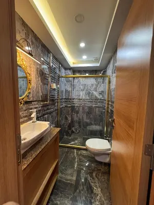 a bathroom with a toilet and a sink and a shower at Gulhane Corner Hotel in Istanbul