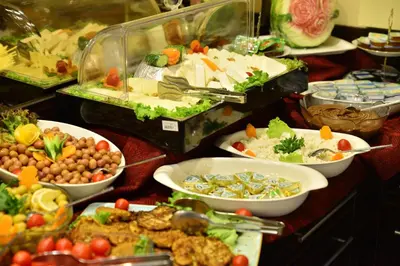 a buffet with many plates of food on a table at Golden Siyav Hotel in Istanbul