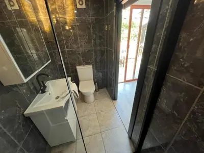 a bathroom with a toilet and a sink and a shower at Le Safran Suite Hotel in Istanbul