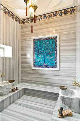 a bathroom with two sinks and a painting on the wall at Sokullu Pasa Hotel - Special Class in Istanbul