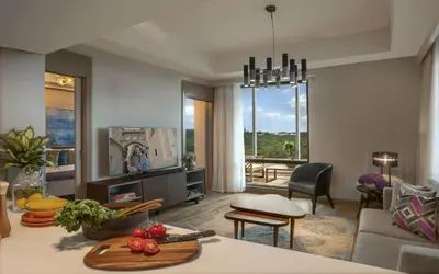 a living room with a couch and a table at Somerset Maslak Istanbul in Istanbul