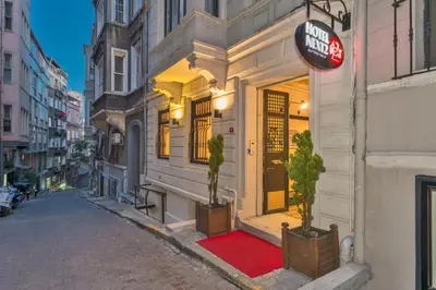 a street with a red rug in front of a building at Taksim Istiklal Street Next2 Hotel in Istanbul