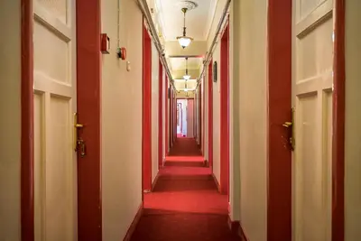 an empty hallway with red walls and a red floor at Erenler HoTeL & HosTeL in Istanbul