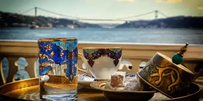 a table with two cups and a plate and a glass at Erenler HoTeL & HosTeL in Istanbul