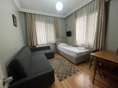 a living room with a couch and a table at Topkapi Apartments in Istanbul