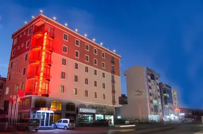 a building with a red light on the side of it at Grand Gebze Hotel in Gebze