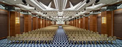 an aisle of an auditorium with rows of chairs at Doubletree By Hilton Istanbul Topkapi in Istanbul