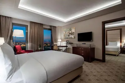 a hotel room with a bed and a television at Doubletree By Hilton Istanbul Topkapi in Istanbul