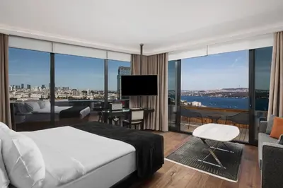 a bedroom with a bed and a view of the city at Gezi Hotel Bosphorus, Istanbul, a Member of Design Hotels in Istanbul