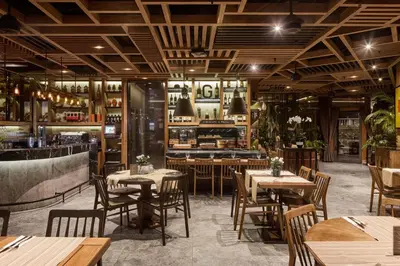 a restaurant with tables and chairs and a bar at Gezi Hotel Bosphorus, Istanbul, a Member of Design Hotels in Istanbul