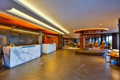 a lobby of a hotel with a reception desk at Hotel Anatolia in Bursa