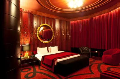 a hotel room with a bed and a chair at Taxim Hill Hotel in Istanbul