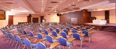 a large room with chairs and a stage in the background at EmexOtel Kocaeli in Kocaeli