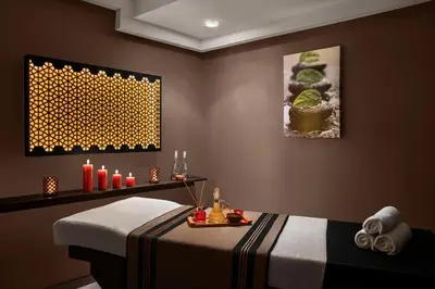 a room with a table with candles and a table with a bed at AKKA Lush Hotel Taksim in Istanbul