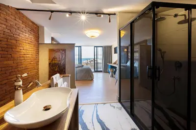 a bathroom with a sink and a glass shower at Sublime Porte Hotel in Istanbul