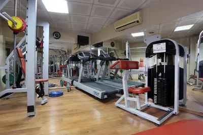 a gym with several treadmills and machines at Balturk Hotel Sakarya in Sakarya