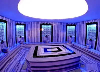 a large room with a large room with a tub in it at Seckin Hotel in Sakarya