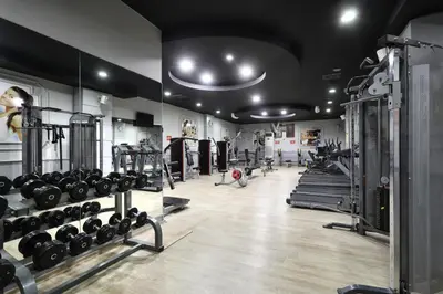 a gym with dumbbells and other fitness equipment at Seckin Hotel in Sakarya