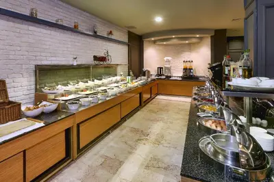 a buffet line in a restaurant with a lot of food at Seckin Hotel in Sakarya