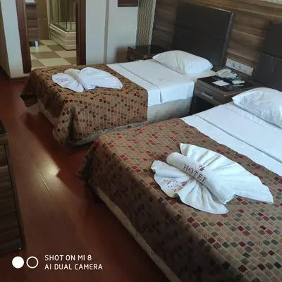 two beds in a hotel room with towels on them at Hotel Bazaar in Istanbul