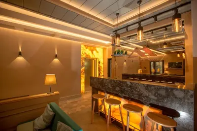 a bar in a restaurant with stools and a counter at Anatolia Inn in Istanbul